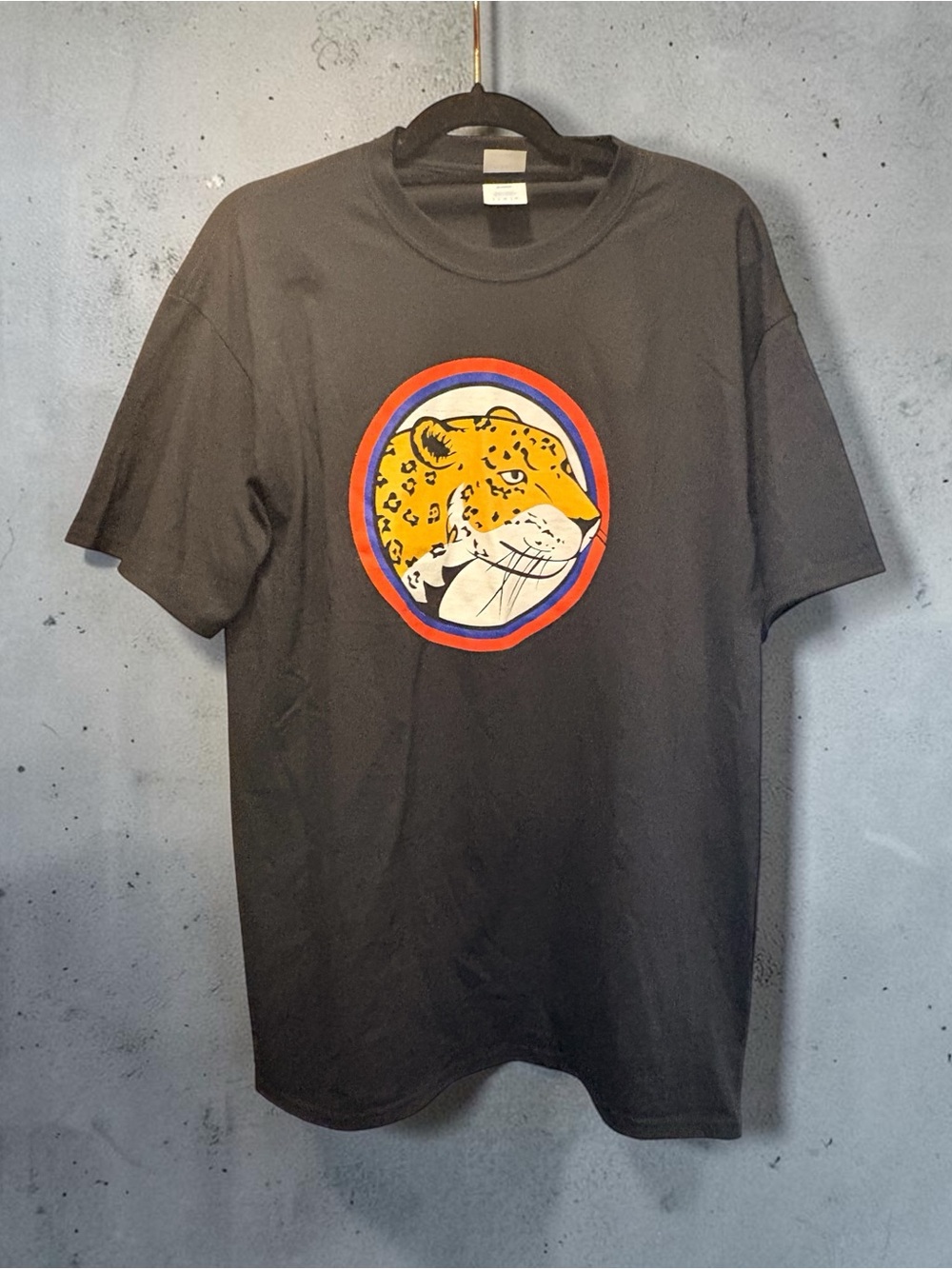Port and Company Black Tee with Yellow Leopard Head and Red-Blue Ring
